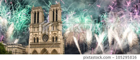 Celebratory fireworks over the Notre Dame de Paris, also known as Notre Dame Cathedral or simply Notre Dame, is a Gothic, Roman Catholic cathedral of Paris, France 105295816