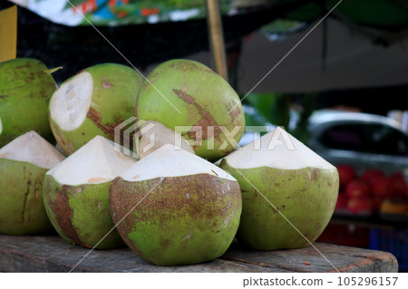 Whole coconut fruits pile. Whole coconut fruits pile. 105296157