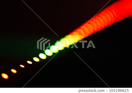 Bokeh effect of red green LED stripe lights over black background Bokeh effect of red green LED stripe lights over black background 105296625