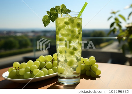 Fresh drink with greengrape and mint, cold summer greengrape ade, healthy mocktail. Sunny day shadows on blue sky background with copy space. Layout for wide banner, sunny 105296885