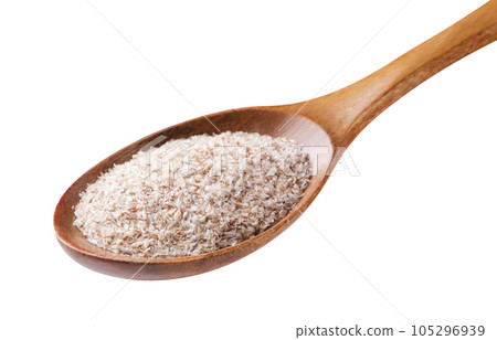 Psyllium in a wooden spoon close-up on a white background. 105296939