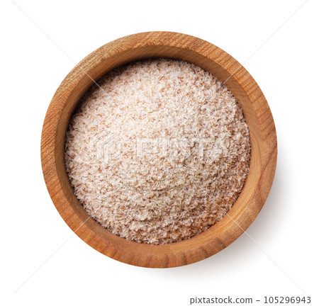 Psyllium in a wooden plate on a white background. Top view 105296943