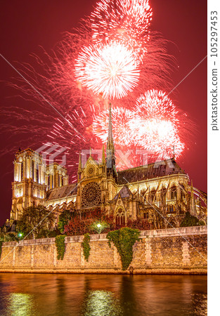 Celebratory fireworks over the Notre Dame de Paris, also known as Notre Dame Cathedral or simply Notre Dame, is a Gothic, Roman Catholic cathedral of Paris, France 105297453