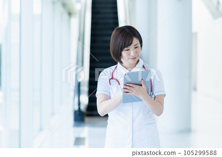 Young female nurse working in a hospital 105299588