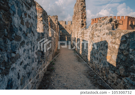 Fortress ruins of the historical Red Tower - Kizil Kule, in Alanya Castle. Fortress ruins of the historical Red Tower - Kizil Kule, in Alanya Castle. 105300732