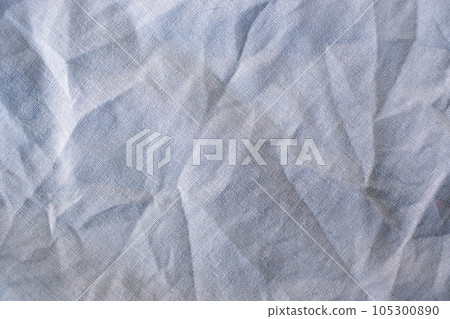 Linen natural fabric, pastel gray shade of color, crumpled natural fabric texture, top view 105300890