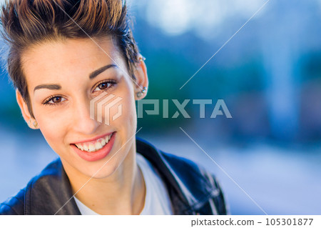 headshot froma a yooung hispanic female. Beautiful woman with an ambiguous hairsyling headshot froma a yooung hispanic female. Beautiful woman with an ambiguous hairsyling 105301877