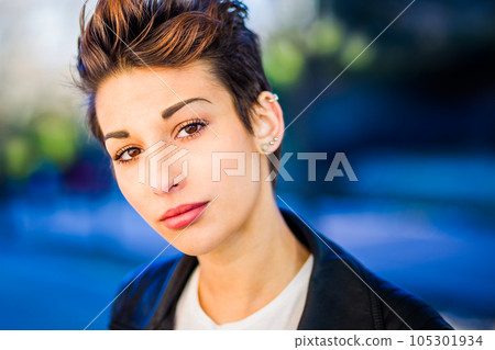 headshot froma a yooung hispanic female. Beautiful woman with an ambiguous hairsyling headshot froma a yooung hispanic female. Beautiful woman with an ambiguous hairsyling 105301934