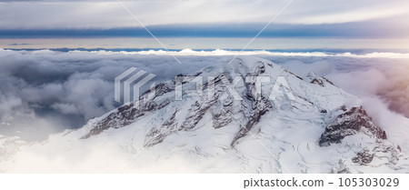 Mt Baker covered in snow and clouds. Aerial landscape nature background. Mt Baker covered in snow and clouds. Aerial landscape nature background. 105303029