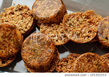 Crunchy homemade cookies on glass plate on gray background Crunchy homemade cookies on glass plate on gray background 105303353