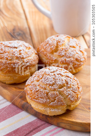 Heap of oat cookies on wooden board Heap of oat cookies on wooden board 105303505