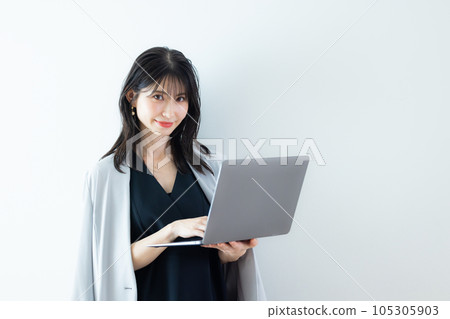 A woman in a black dress 105305903