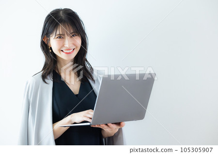 A woman in a black dress 105305907