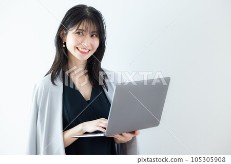 A woman in a black dress A woman in a black dress 105305908