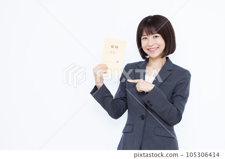 A working woman in a suit holding a pay bag in front of a white background A working woman in a suit holding a pay bag in front of a white background 105306414