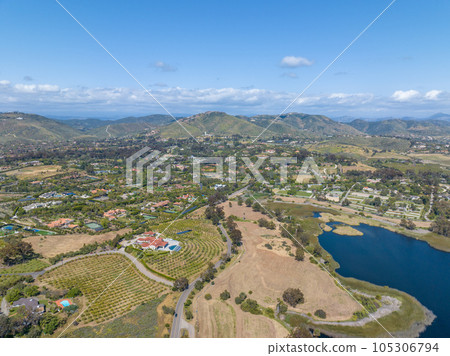 Aerial view over water reservoir and a large dam that holds water. Rancho Santa Fe in San Diego 105306794