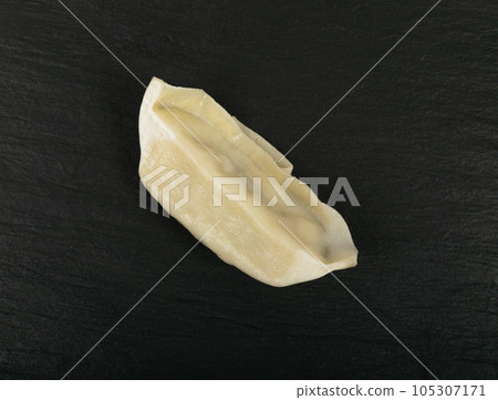 Single Gyoza Chinese Dumpling, Steamed Vegetable Jiaozi, Chicken Momo, One Asian Gyoza on Black Single Gyoza Chinese Dumpling, Steamed Vegetable Jiaozi, Chicken Momo, One Asian Gyoza on Black 105307171