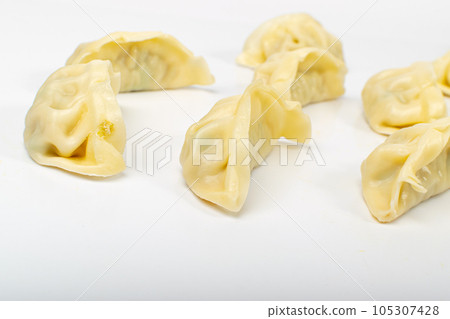 Gyoza Chinese Dumplings on WHite, Vegetable Jiaozi, Chicken Momo Pile, Asian Gyoza Group Gyoza Chinese Dumplings on WHite, Vegetable Jiaozi, Chicken Momo Pile, Asian Gyoza Group 105307428