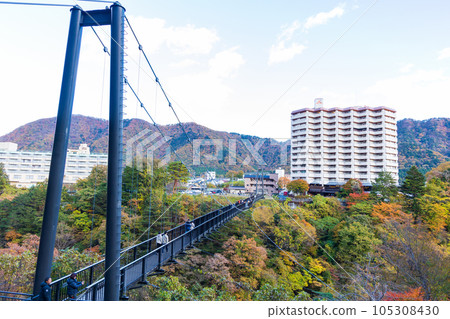 Tochigi Nikko City Kinugawa Onsen with autumn leaves Kinu Tateiwa Otsuribashi Bridge 105308430