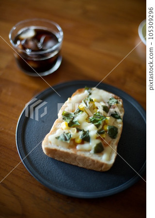 Breakfast with pizza toast made with home-grown basil Breakfast with pizza toast made with home-grown basil 105309296