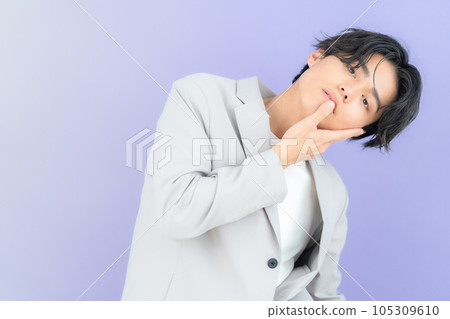 young man with purple back young man with purple back 105309610