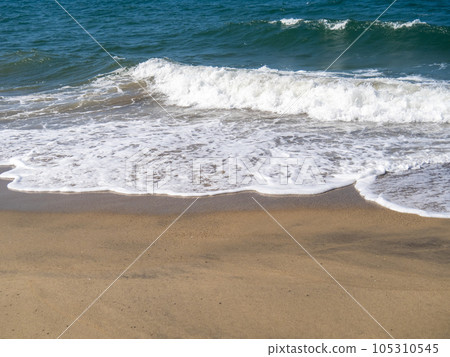 Waves on the sandy beach. Waves on the sandy beach. 105310545