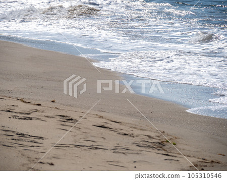 Beach of the sandy beach of the blue sea in summer (July). Beach of the sandy beach of the blue sea in summer (July). 105310546