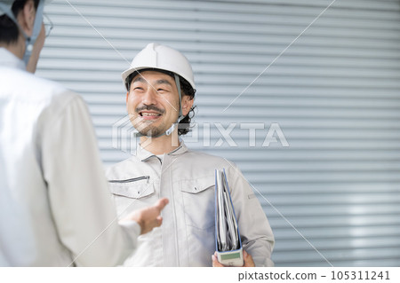 people working in a factory facility people working in a factory facility 105311241
