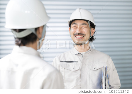 people working in a factory facility people working in a factory facility 105311242