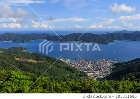 Koniya on Amami Oshima and Kakeroma Island on the opposite shore Koniya on Amami Oshima and Kakeroma Island on the opposite shore 105311686
