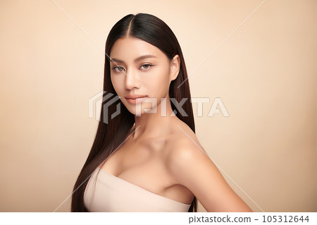 Beautiful young asian woman with clean fresh skin on beige background, Face care, Facial treatment, Cosmetology, beauty and spa, Asian women portrait. Beautiful young asian woman with clean fresh skin on beige background, Face care, Facial treatment, Cosmetology, beauty and spa, Asian women portrait. 105312644