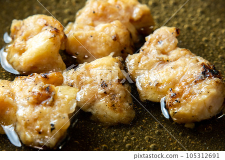 The remaining yakitori (bonjiri) remake cooking scene. Boil in a frying pan with dashi stock to bind the egg. The remaining yakitori (bonjiri) remake cooking scene. Boil in a frying pan with dashi stock to bind the egg. 105312691