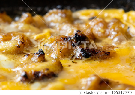 Yakitori (Bonjiri) cooking scene with eggs. Leftover yakitori remake image. 105312770