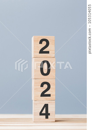 wooden cube block with 2024 text on table background. Resolution, plan, review, goal, start and New Year holiday concepts wooden cube block with 2024 text on table background. Resolution, plan, review, goal, start and New Year holiday concepts 105314055