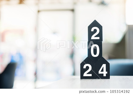 2024 Happy New Year with wooden Home model on table office. New House, Financial, Property insurance and real estate concepts 2024 Happy New Year with wooden Home model on table office. New House, Financial, Property insurance and real estate concepts 105314192