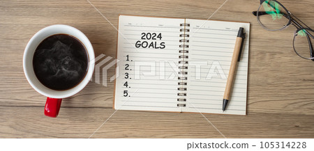 2024 GOAL with notebook, black coffee cup and pen on wood table, Top view and copy space. Happy New Year, Resolution, To do list, Strategy and Plan concept 2024 GOAL with notebook, black coffee cup and pen on wood table, Top view and copy space. Happy New Year, Resolution, To do list, Strategy and Plan concept 105314228