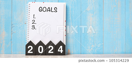 2024 Happy New Year with GOAL word and wooden number. time for a New Start, Resolution, Plan, Action and Mission Concept 105314229