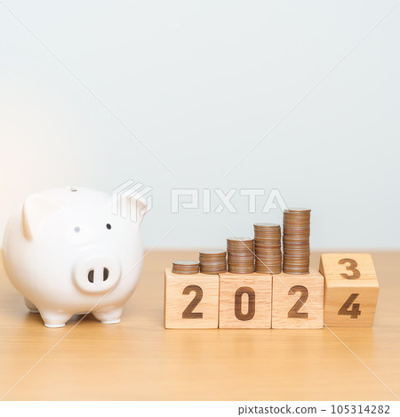 Happy New Year with piggy bank and flipping 2023 change to 2024 block. Resolution, Goals, Plan, Action, Money Saving, Retirement fund, Pension, Investment and Financial concept 105314282