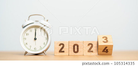 Happy New Year with vintage alarm clock and flipping 2023 change to 2024 block. Christmas, New Start, Resolution, countdown, Goals, Plan, Action and Motivation Concept Happy New Year with vintage alarm clock and flipping 2023 change to 2024 block. Christmas, New Start, Resolution, countdown, Goals, Plan, Action and Motivation Concept 105314335