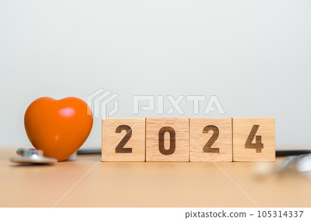 2024 Happy New Year for health care, Insurance, Wellness and medical concept. Stethoscope of doctor on table 2024 Happy New Year for health care, Insurance, Wellness and medical concept. Stethoscope of doctor on table 105314337