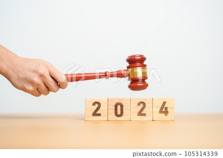 2024 block with judge gavel on table. Law, lawyer, judgment, justice auction and bidding concept 105314339