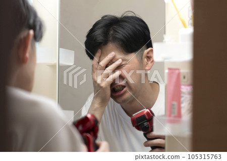 Man suffering from lack of sleep, headache, hangover Man suffering from lack of sleep, headache, hangover 105315763