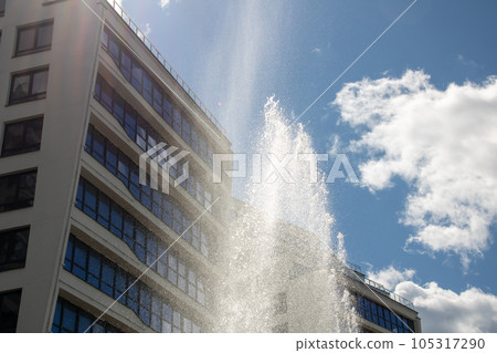 High jets of water fountain in the city 105317290