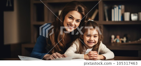 Happy child and adult are sitting at desk. Girl doing homework or online education 105317463