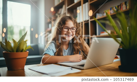 Happy child and adult are sitting at desk. Girl doing homework or online education 105317469