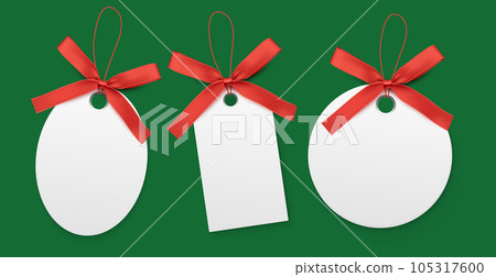 Blank white labels with red bow isolated on green background. Blank white labels with red bow isolated on green background. 105317600