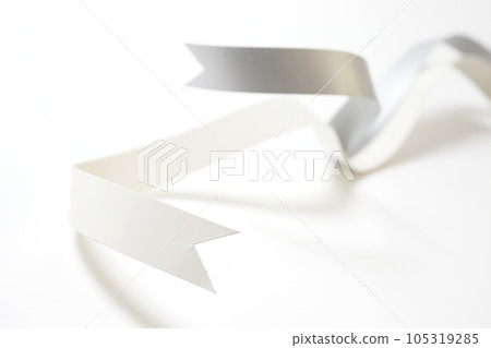Silver and white ribbon taken against a white background Silver and white ribbon taken against a white background 105319285