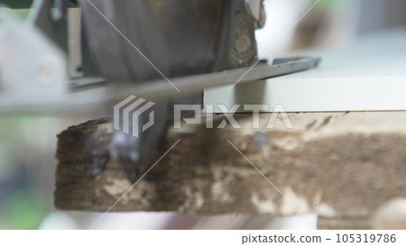 smooth movements with the saw along the marked cutting line on the chipboard. smooth movements with the saw along the marked cutting line on the chipboard. 105319786