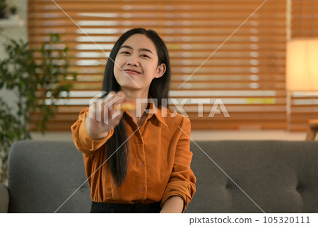 Happy woman enjoying in weekend eating pizza for lunch in cozy living room Happy woman enjoying in weekend eating pizza for lunch in cozy living room 105320111