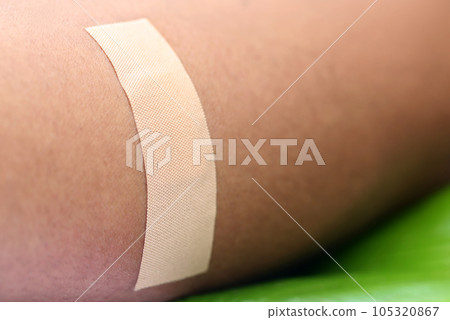 Plaster on human skin 105320867